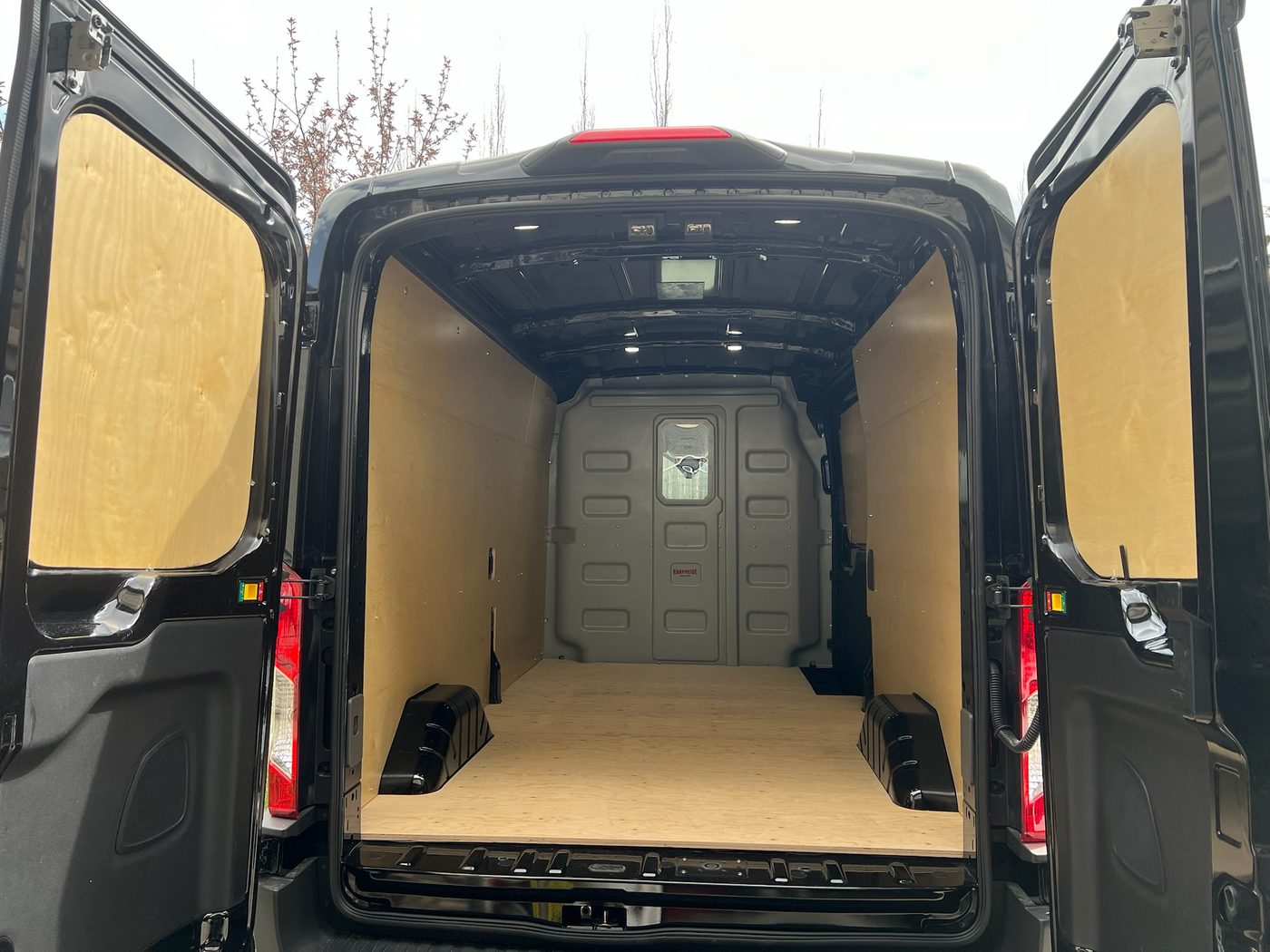 Plywood wall and floor lining — clean protected interior